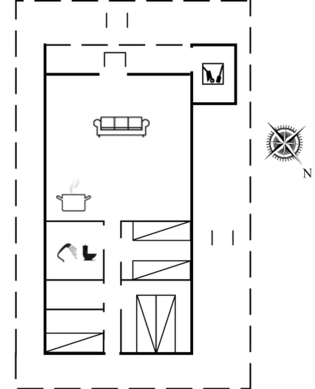 Un plan d’étage comprenant un espace cuisine, une table à manger, un canapé et une boussole indiquant le nord.