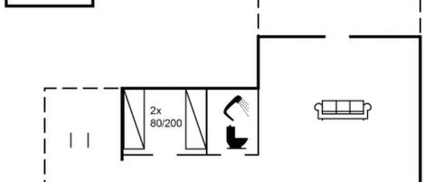 A floor plan with a kitchen, two bathrooms, a living room, and a dining area.