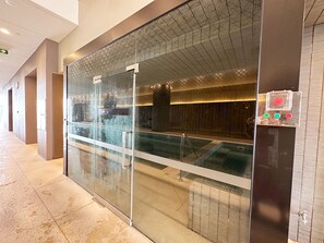 Experience the serene ambiance of our hotel lobby, featuring a tranquil water feature and a STEAM room.