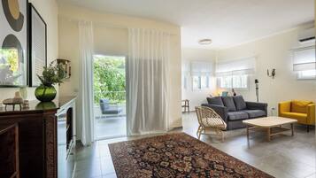 Apartment | Living area | 65-inch Smart TV with digital channels