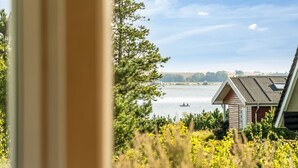 A lakeside cabin with a view of the water and distant trees. - "Eljas" - 200m to the fjord by Interhome (Fur)