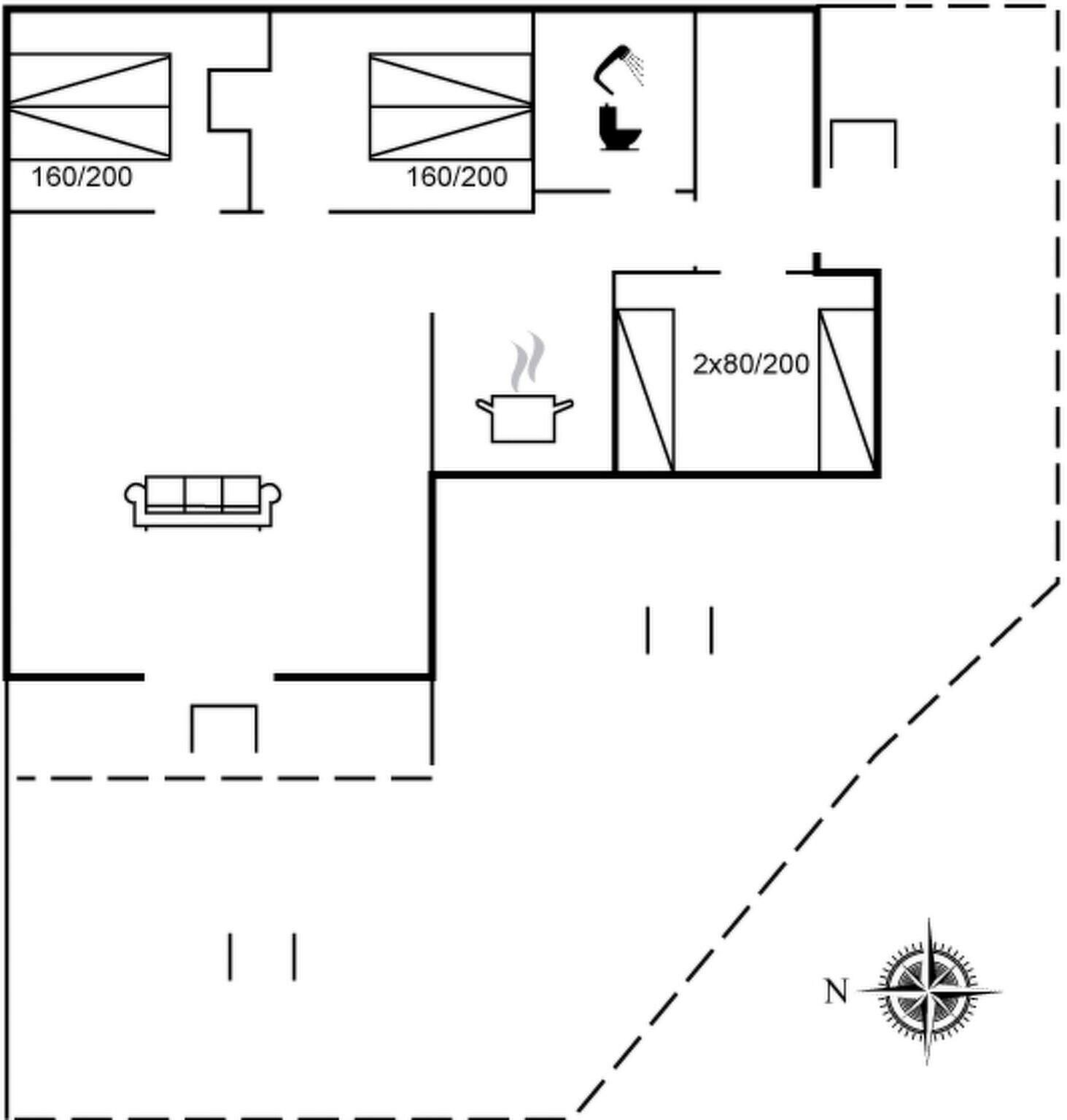 A floor plan with a kitchen, two bathrooms, a living area with a sofa, and a dining area.