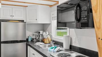 Fridge, microwave, stovetop, coffee/tea maker