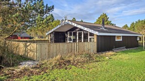 A single-story building with a sloped roof, a satellite dish, and a chimney. - "Alaia" - 1km from the sea by Interhome (Vejers Strand)