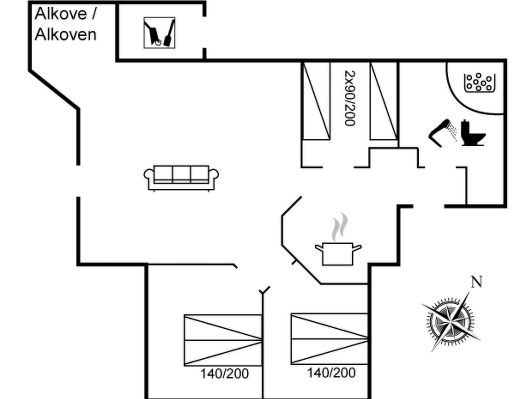 A floor plan with a kitchenette, a bathroom, and a living area with a sofa.