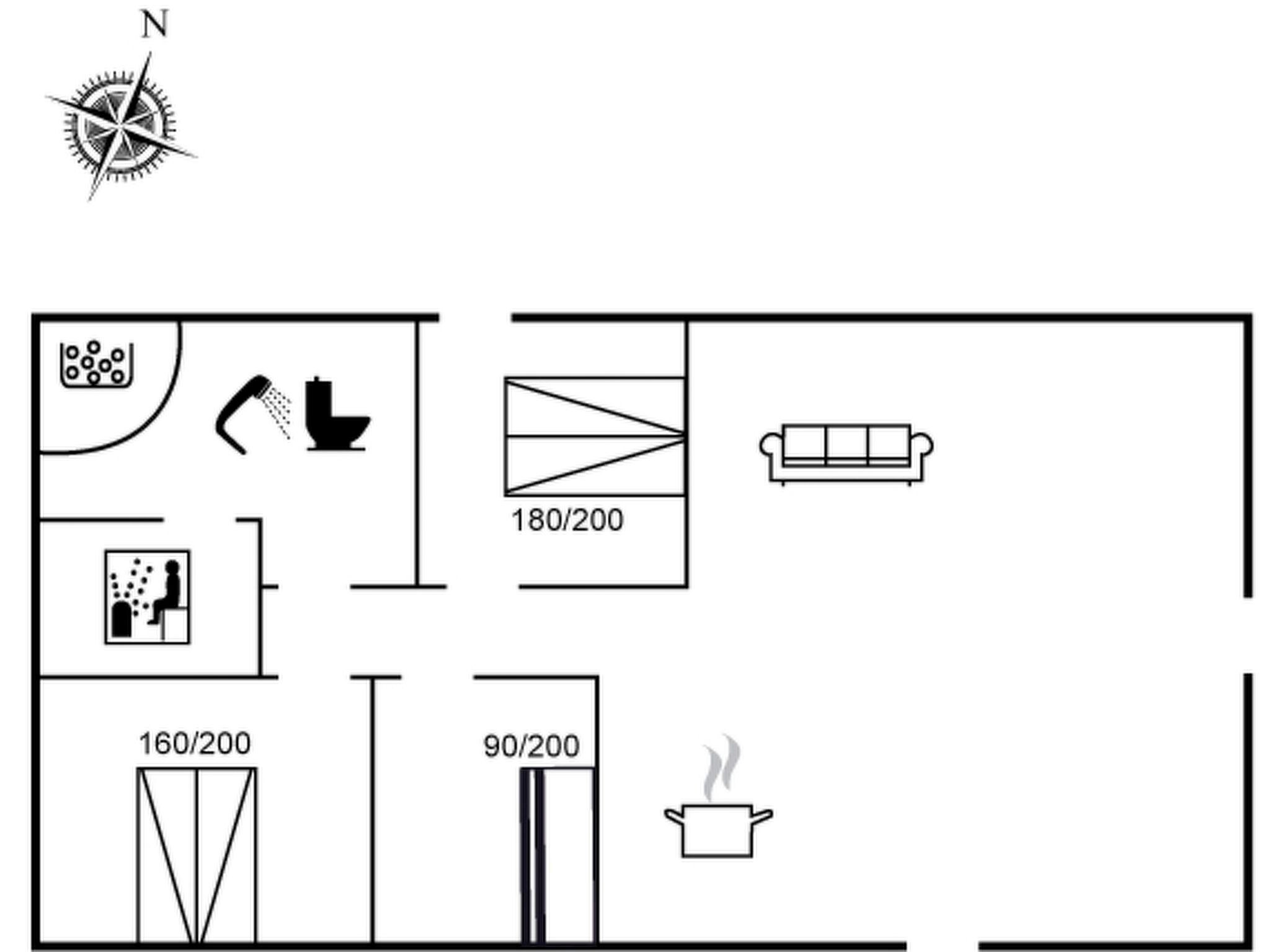 Ein Grundriss mit einer Küche, einem Badezimmer und einem Wohnbereich.