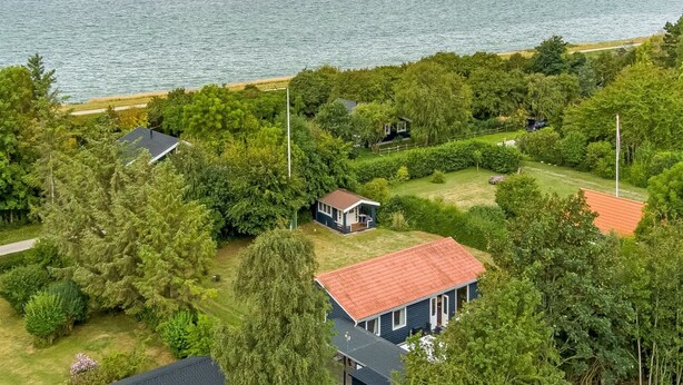 A coastal residential area with houses surrounded by dense greenery and a view of the sea. - "Rikhard" - 75m from the sea by Interhome (Dannemare)