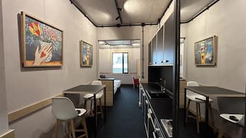 Mini-fridge, oven, stovetop, cookware/dishes/utensils