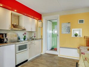 Fridge, oven, highchair, cookware/dishes/utensils