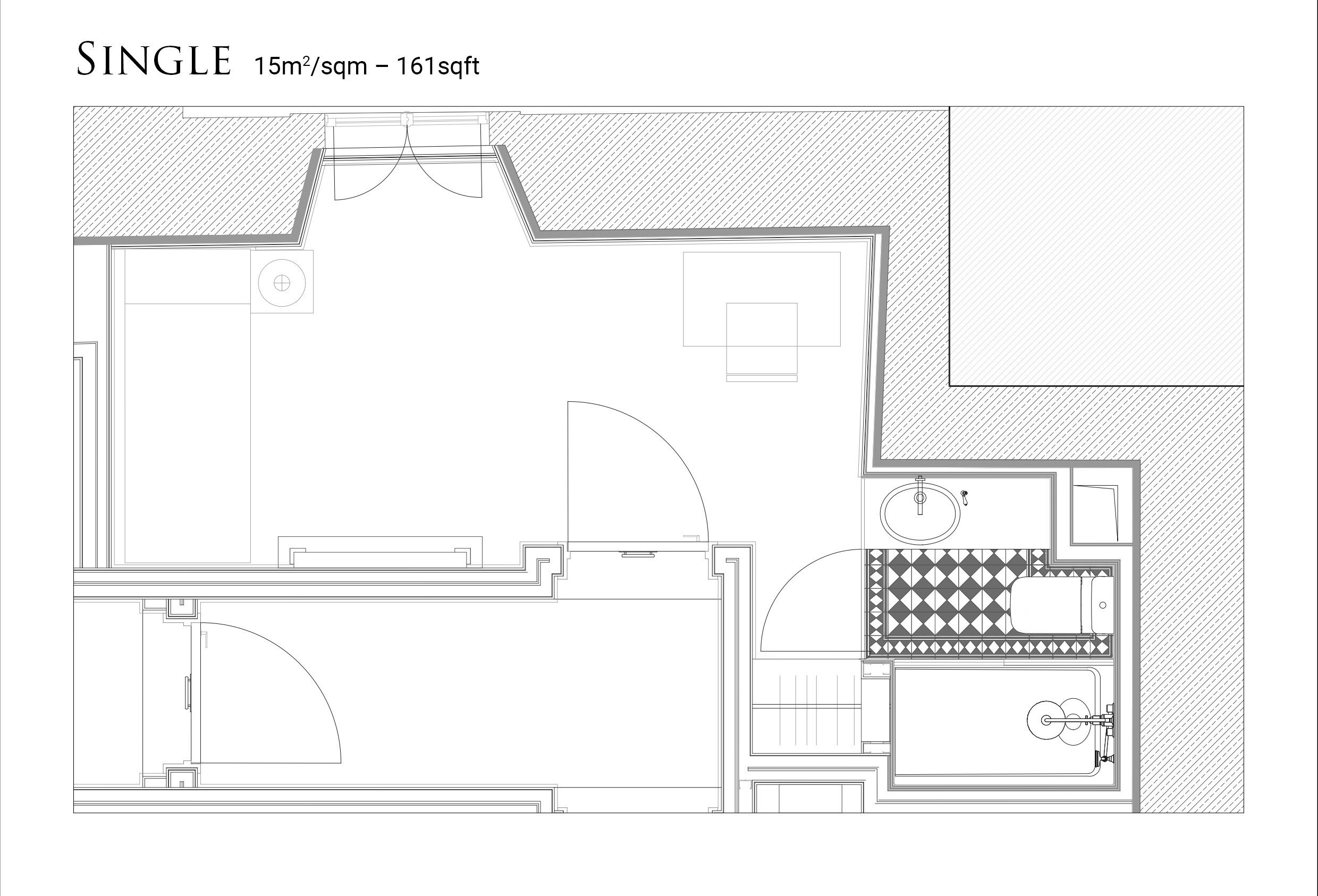 A single room layout with a bathroom, kitchenette, and a curved seating area.