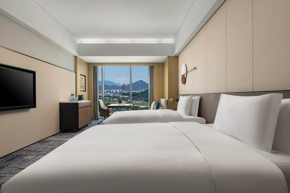Luxe beddengoed, donsdekens, een minibar, een kluis op de kamer