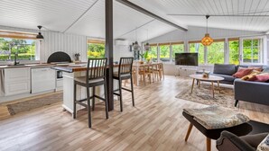 A spacious living area with a kitchen, dining table, and seating. - "Valdemar" - 350m to the fjord by Interhome (Tarm)