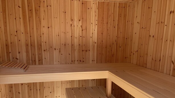 A sauna room with wooden walls and benches. - "Gudrid" - 500m from the sea by Interhome (Fanø)