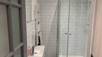 Apartment, 1 Queen Bed | Bathroom | Shower, hair dryer, towels