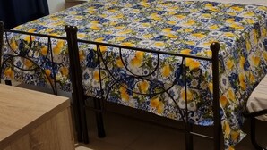 A bedroom with a bed, a bedside table, and a nightstand. - Room with breakfast included in cottage Holiday home in Palmi Pietrenere. (Palmi)