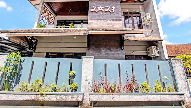 A two-story building with a prominent sign above the entrance. - OYO Life 92575 Zazi Homestay (Depok)