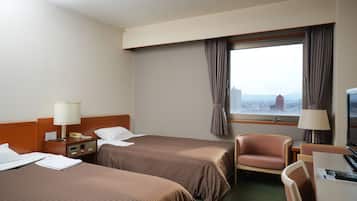 Standard Twin Room | Desk, blackout drapes, iron/ironing board, free WiFi