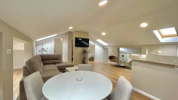 Family Apartment | Living area | 50-inch LCD TV with cable channels