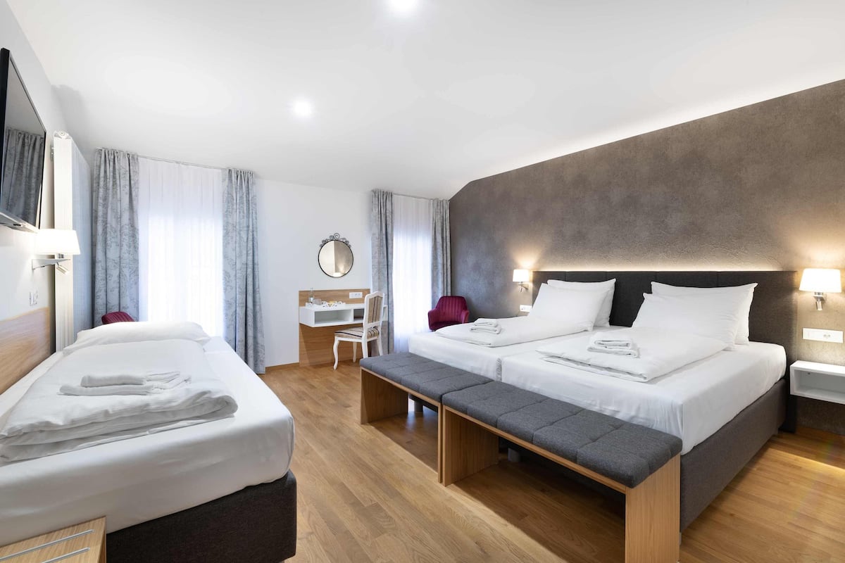 Superior Triple Room | Desk, laptop workspace, blackout drapes, iron/ironing board (on request)