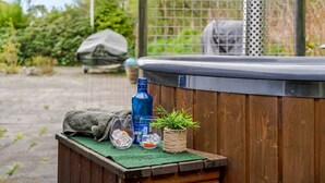A wooden bench with a green mat, a blue bottle, two glasses with ice, and a small potted plant. - "Sigfred" - 1.5km from the sea by Interhome (Hals)