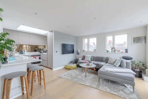 Basic Apartment, Multiple Beds | Living area | TV