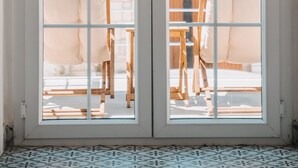 A view through a glass door with a tiled floor. - Mea Reisdere (Cesme)