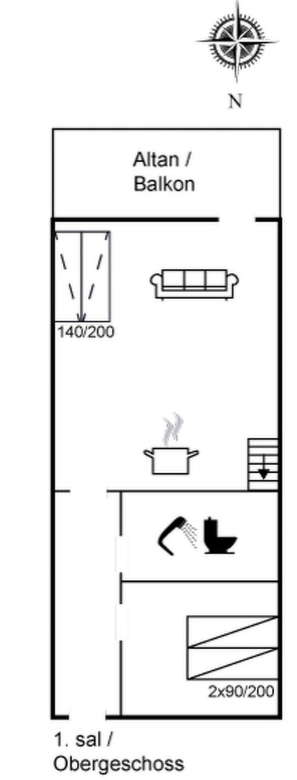 Planta baixa mostrando uma varanda, sofá, área de cozinha com fogão e um sanitário.