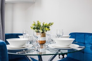 Enjoy meals with family and friends in this cozy dining area, complete with a round table and comfortable seating.