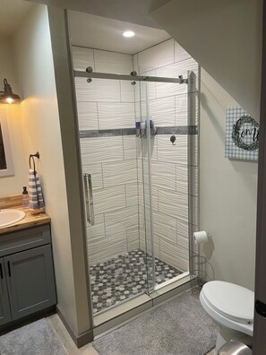Shower, hair dryer, towels, soap