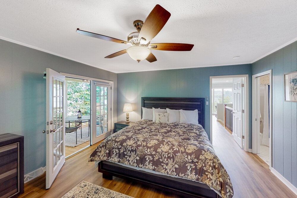 Lakefront house with dock, firepit, pool, tennis, gym, & golf dog