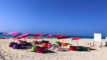 Private beach, beach umbrellas