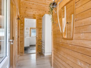 A wooden interior with a hallway leading to a kitchen area. - "Jorina" - 700m to the fjord by Interhome (Ringkøbing)