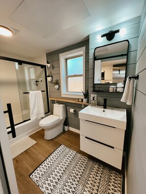 Shower, hair dryer, towels, soap