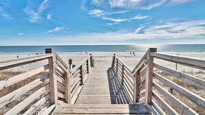 A wooden boardwalk leading to a beach with a clear sky. - Luxury 3 Bedroom Villa @ N. Beach Resort - Walk to Everything! Beach/Pools/Food (North Myrtle Beach)
