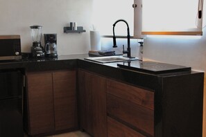 Microwave, stovetop, coffee/tea maker, cookware/dishes/utensils