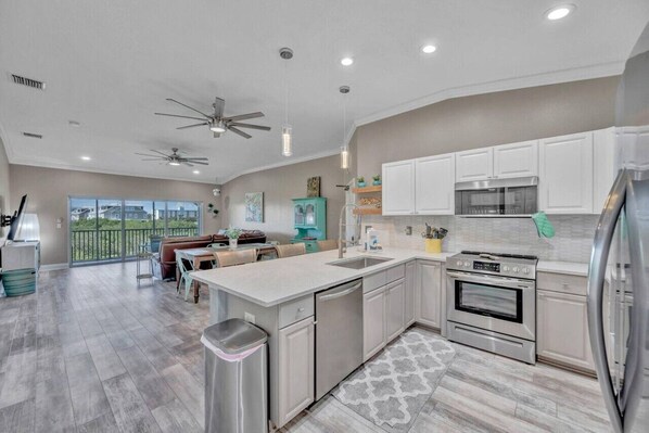 Fridge, microwave, oven, stovetop - "MP 203 Luxurious Family-Friendly Townhome with Pool and Private Patio in Indian Shores" (Indian Shores)