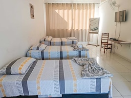 Standard Quadruple Room | Minibar, individually decorated, desk, laptop workspace