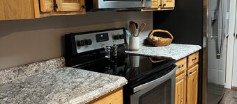 Quiet neighborhood surrounded by parks near multipurpose trail through QC
