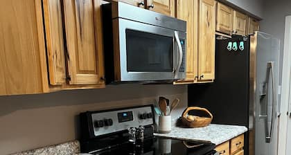 Quiet neighborhood surrounded by parks near multipurpose trail through QC