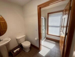 Shower, hair dryer, towels, toilet paper