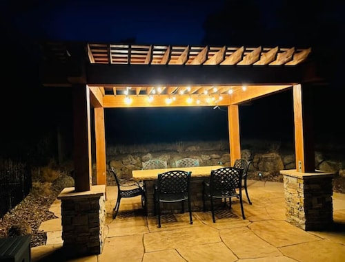 Cheerful Cabin with large stone patio and hot tub, next to trails!!