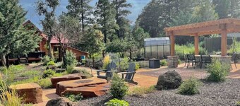 Cheerful Cabin with large stone patio and hot tub, next to trails!!