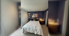 A bedroom with a bed, bedside tables, and wall decorations.