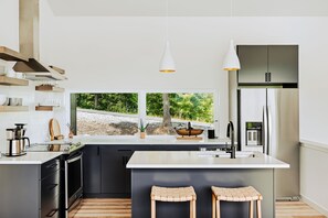 Fridge, microwave, oven, stovetop - Letting Geaux is a 4BR/3BA holiday mountain retreat for 8, featuring a private hot tub, game room, ethanol fireplace, firepit & a spacious deck for festive gatherings. Perfect for cozy winter escapes, Christmas celebrations & family holiday memories. (Young Harris)