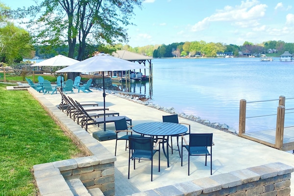 Lakeside patio with beach beyond