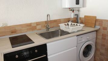 Fridge, oven, cookware/dishes/utensils