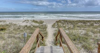 10 steps away till sand in your toes on the ocean front in Carolina Beach, NC.
