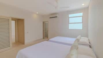 Premium bedding, memory-foam beds, desk, laptop workspace