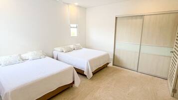 3 bedrooms, premium bedding, memory-foam beds, desk