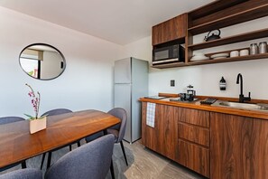 Fridge, microwave, stovetop, coffee/tea maker
